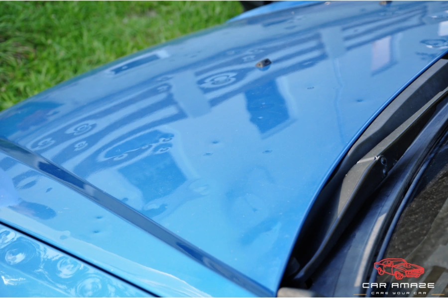 Dents due to hail damage on car